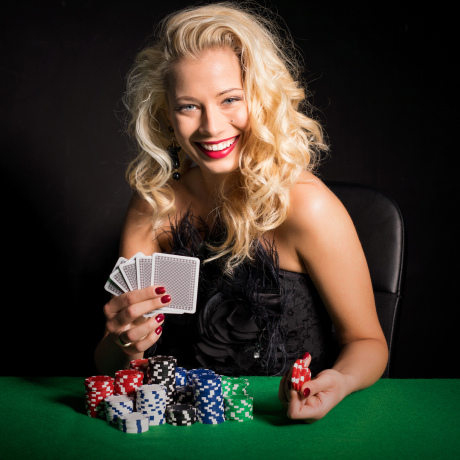 Woman holding poker cards
